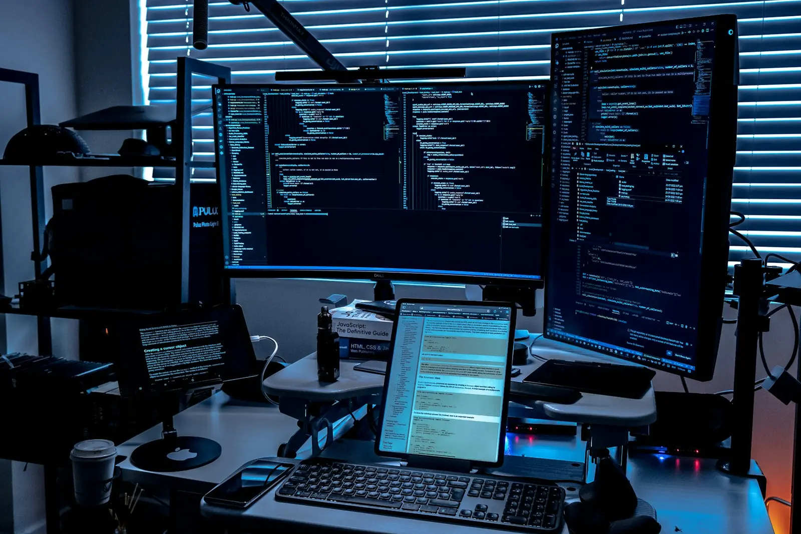 Security engineers monitoring several screens in an operations room